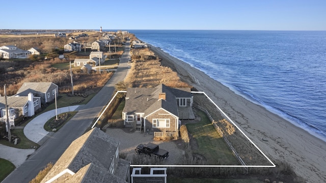 aerial view with a water view and a view of the beach