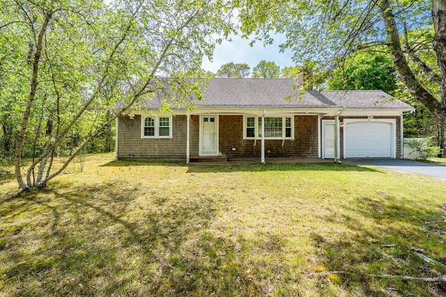 121 S Yarmouth Rd, Dennis, MA 02638 - single story home featuring a garage, driveway, a front lawn, and a chimney