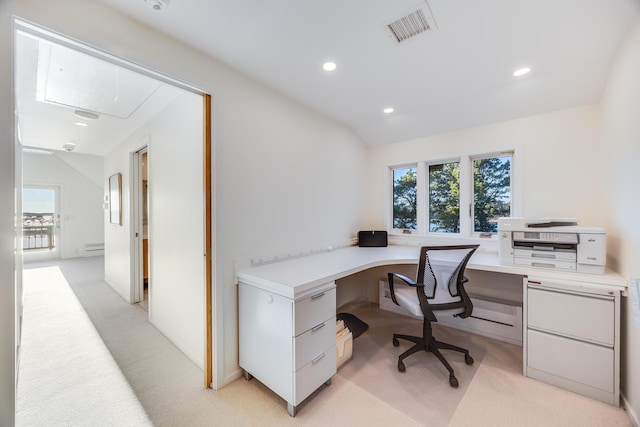 office space featuring light carpet and vaulted ceiling