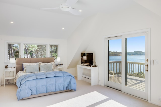 bedroom with ceiling fan, access to exterior, multiple windows, and lofted ceiling