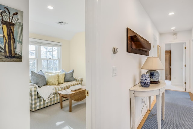 hallway featuring carpet, visible vents, lofted ceiling, and recessed lighting