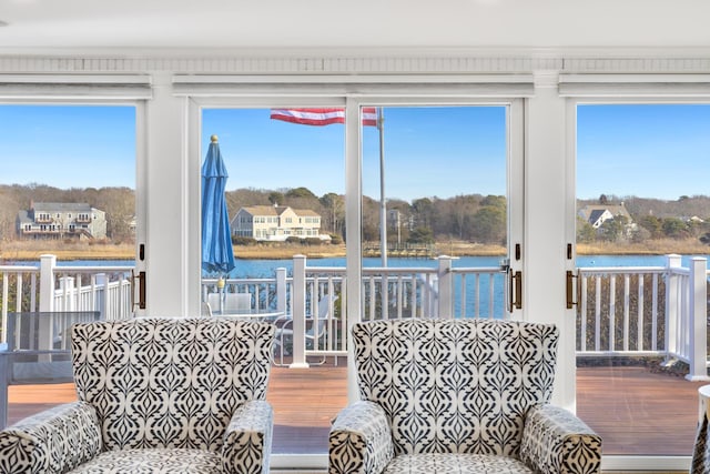 sunroom / solarium with a water view