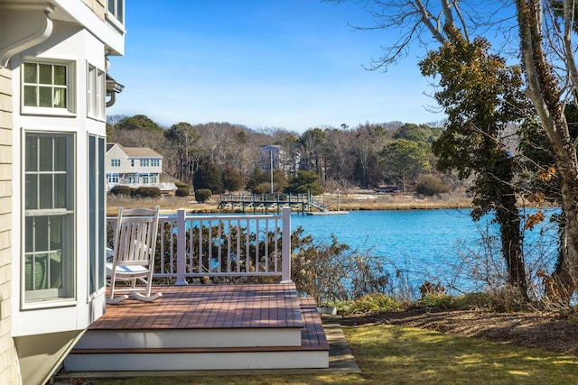 wooden deck with a water view