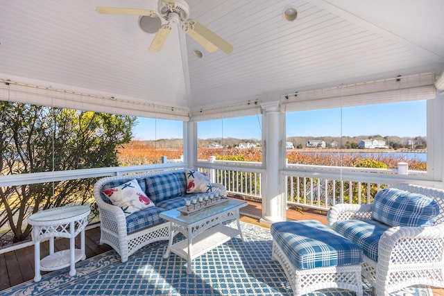 sunroom / solarium with lofted ceiling and ceiling fan