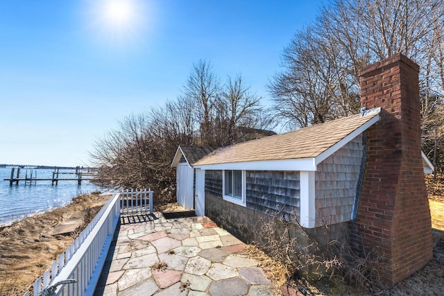 exterior space with a water view