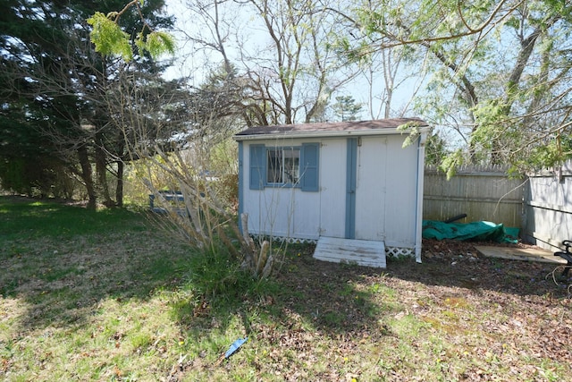 view of shed with fence
