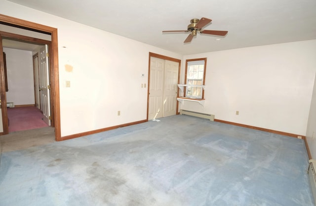 carpeted empty room featuring baseboards, ceiling fan, baseboard heating, and a baseboard radiator