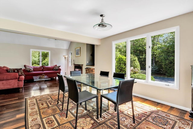 17 Claus Way, Marstons Mills, MA 02648 - dining area with vaulted ceiling, dark wood-style floors, and baseboards