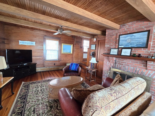 living room featuring hardwood / wood-style flooring, a brick fireplace, wooden ceiling, wooden walls, and beamed ceiling