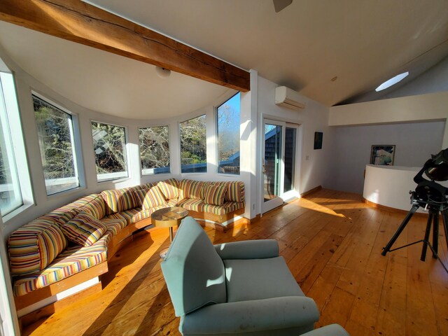 20 Spooner Rd, Eastham, MA 02642 - living room featuring hardwood / wood-style floors, vaulted ceiling with beams, and an AC wall unit