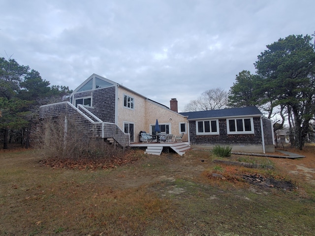 20 Spooner Rd, Eastham, MA 02642 - back of house featuring a lawn and a wooden deck