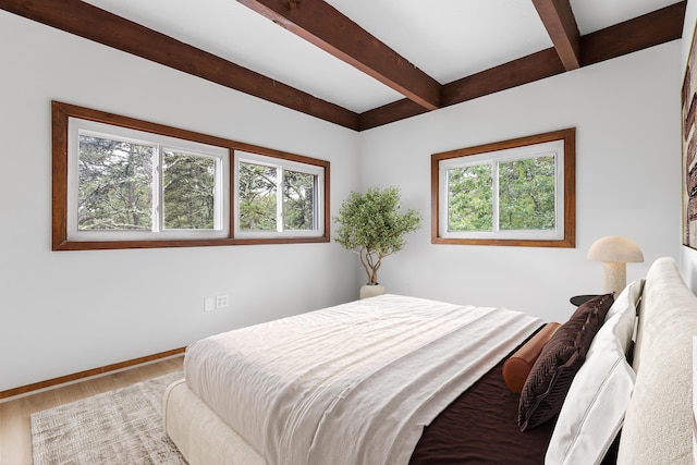 320 Coles Neck Rd, Wellfleet, MA 02667 - bedroom with multiple windows, beam ceiling, and wood finished floors