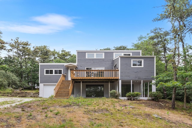 320 Coles Neck Rd, Wellfleet, MA 02667 - back of house featuring an attached garage, stairs, and a wooden deck