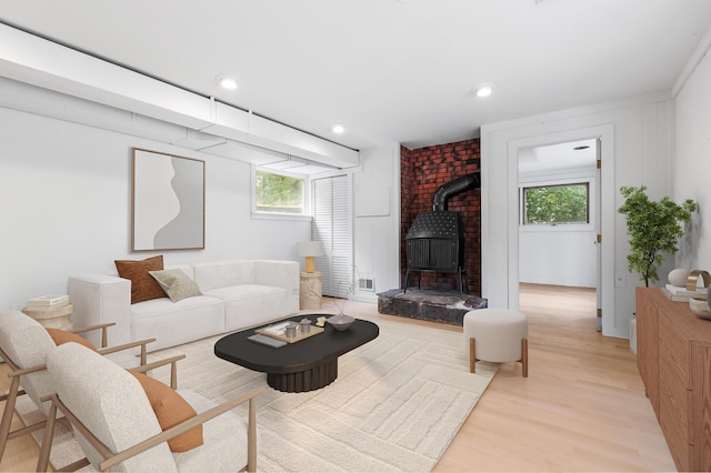 320 Coles Neck Rd, Wellfleet, MA 02667 - living room with a wood stove, light wood-style flooring, and recessed lighting