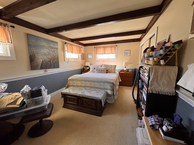 carpeted bedroom featuring beam ceiling