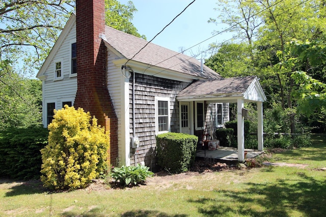 view of home's exterior featuring a yard