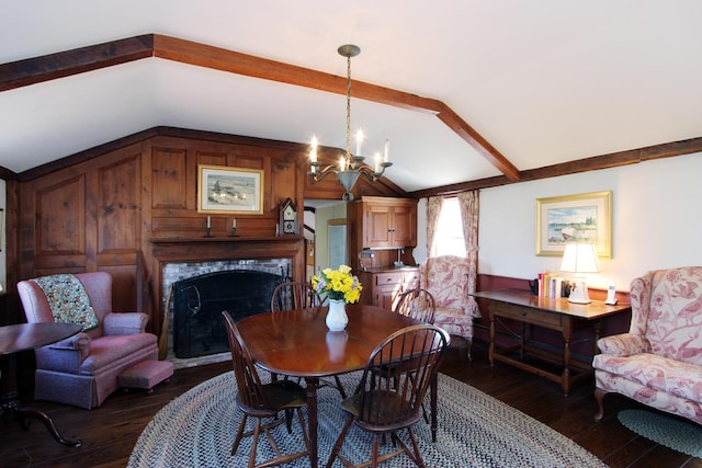 dining space featuring an inviting chandelier, dark wood-type flooring, and lofted ceiling with beams