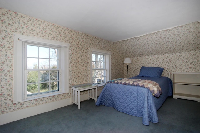 bedroom featuring dark carpet