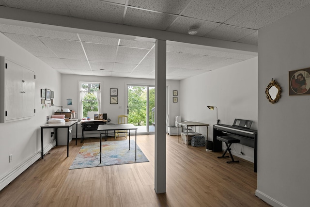4 Canterbury Ln, Bourne, MA 02532 - office featuring a drop ceiling, wood finished floors, baseboard heating, and baseboards
