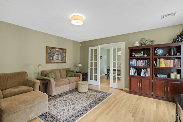 4 Canterbury Ln, Bourne, MA 02532 - living room featuring light wood-style floors and french doors