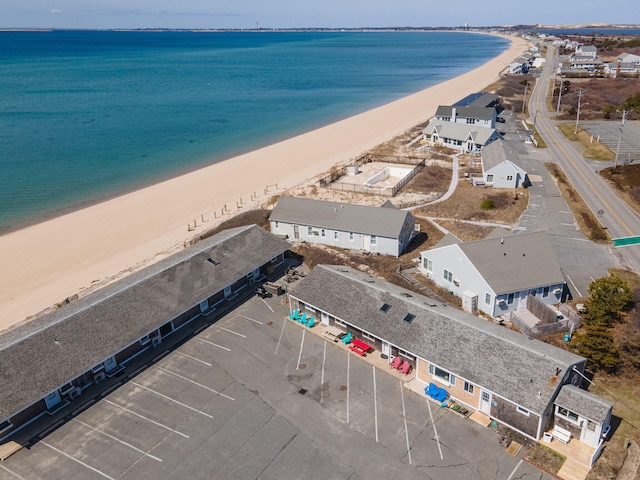 aerial view featuring a water view and a beach view