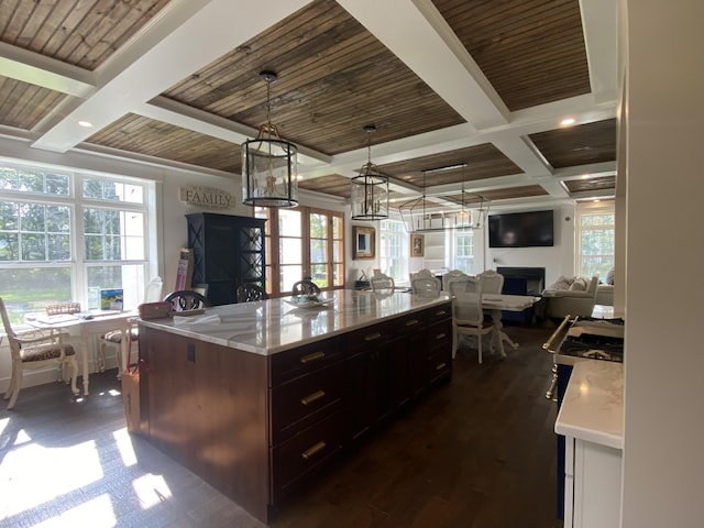 160 Ashumet Rd, East Falmouth, MA 02536 - kitchen with coffered ceiling, open floor plan, a wood ceiling with exposed beams, pendant lighting, and a fireplace