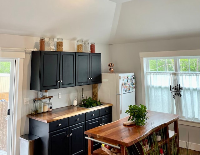 160 Ashumet Rd, East Falmouth, MA 02536 - kitchen with freestanding refrigerator and dark cabinets