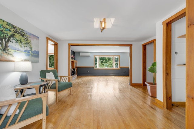 6 Paddock Dr, Harwich, MA 02645 - sitting room with a wall mounted air conditioner and light wood-type flooring