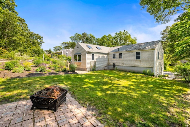 6 Paddock Dr, Harwich, MA 02645 - back of house featuring a fire pit, a yard, and a patio area