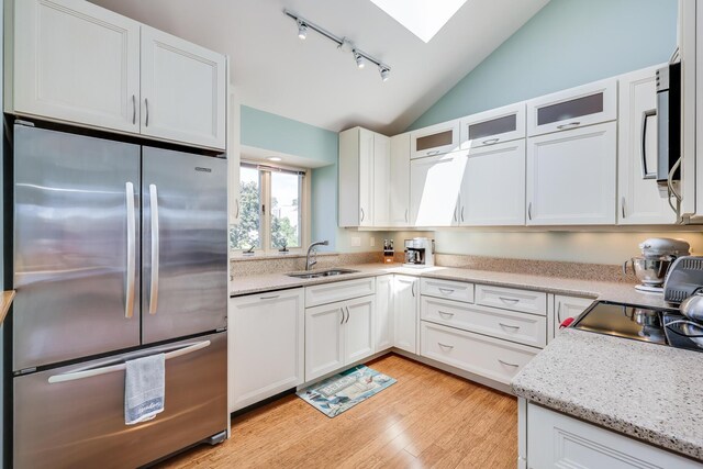 kitchen with sink, white cabinetry, and appliances with stainless steel finishes