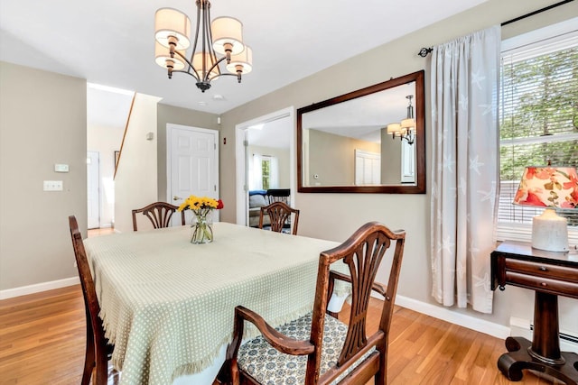 17 Greenway Cir, Sandwich, MA 02563 - dining space with a chandelier, baseboards, and light wood-type flooring