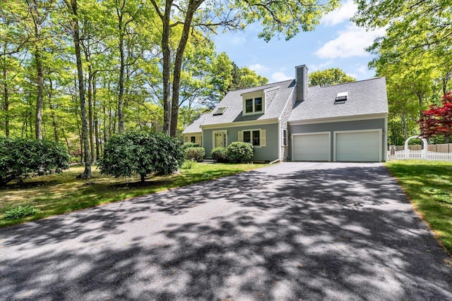 17 Greenway Cir, Sandwich, MA 02563 - cape cod house with asphalt driveway, an attached garage, and a chimney