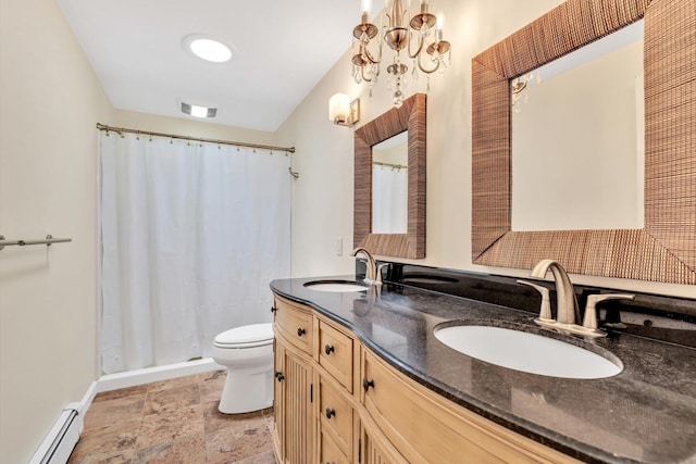 17 Greenway Cir, Sandwich, MA 02563 - bathroom with baseboard heating, toilet, double vanity, a shower with shower curtain, and stone finish floors