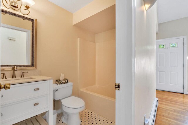 17 Greenway Cir, Sandwich, MA 02563 - full bath featuring a baseboard heating unit, vanity, toilet, bathtub / shower combination, and wood finished floors