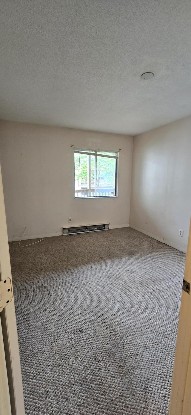 800 Bearses Way Unit 5Nb, Hyannis, MA 02601 - carpeted empty room with a baseboard radiator and a textured ceiling