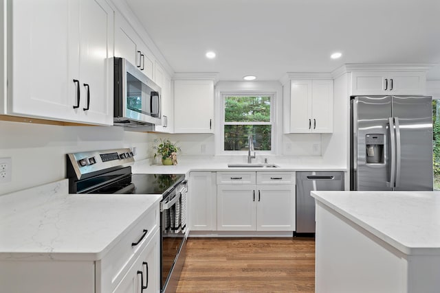 kitchen featuring sink, dark wood-type flooring, white cabinetry, and appliances with stainless steel finishes