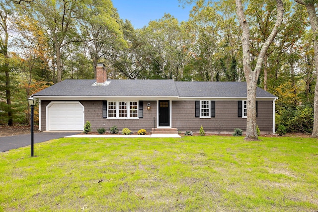 ranch-style home with a garage and a front yard