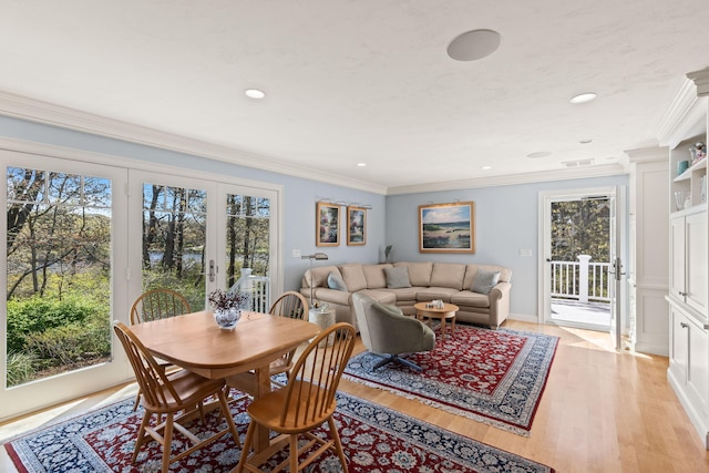 116 Happy Valley Rd, Chatham, MA 02633 - dining room featuring french doors, light wood-style floors, ornamental molding, and recessed lighting