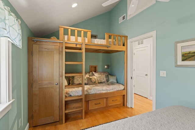 116 Happy Valley Rd, Chatham, MA 02633 - bedroom with vaulted ceiling and light wood-style flooring