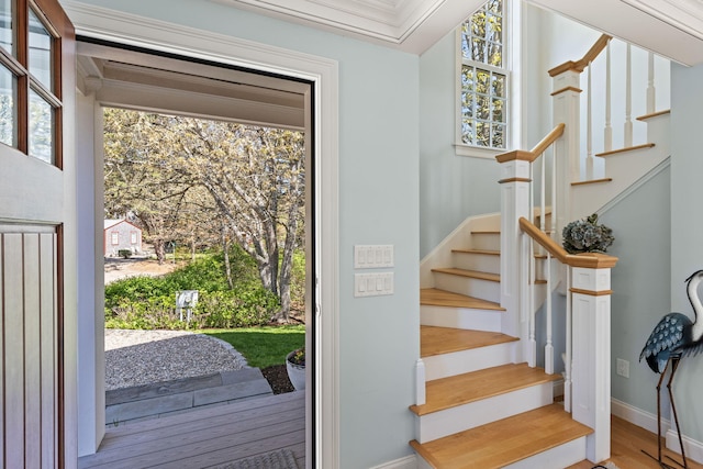 116 Happy Valley Rd, Chatham, MA 02633 - foyer with stairs, wood finished floors, baseboards, and crown molding