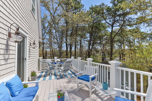 116 Happy Valley Rd, Chatham, MA 02633 - wooden deck featuring outdoor dining space and view of wooded area