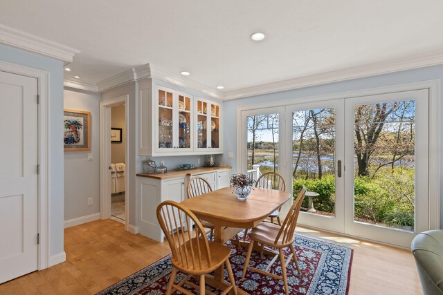 116 Happy Valley Rd, Chatham, MA 02633 - dining area with ornamental molding, light wood-style flooring, recessed lighting, and baseboards