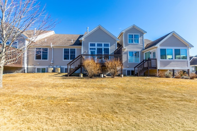 20 Twin Oaks Dr, Mashpee, MA 02649 - back of property featuring stairs, a yard, and a deck