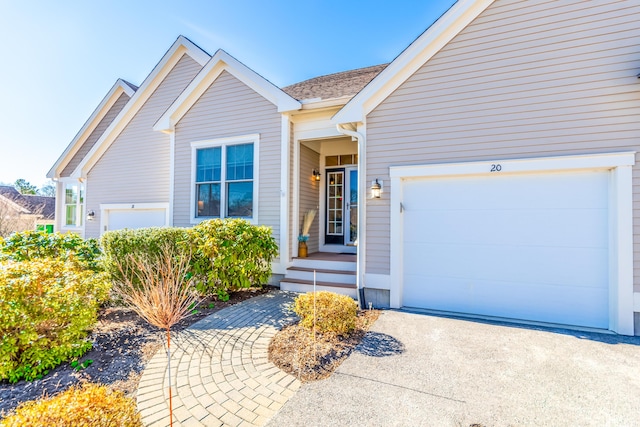 20 Twin Oaks Dr, Mashpee, MA 02649 - view of front facade with driveway, an attached garage, and a shingled roof