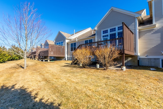 20 Twin Oaks Dr, Mashpee, MA 02649 - rear view of property featuring a wooden deck and a lawn