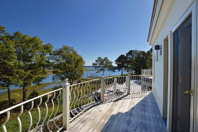 balcony featuring a water view