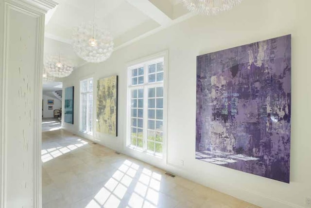 interior space featuring beamed ceiling, coffered ceiling, and a notable chandelier