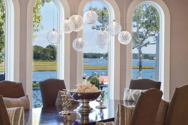 dining room with a water view