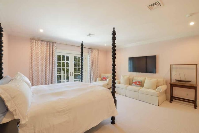 bedroom featuring crown molding, light colored carpet, and french doors