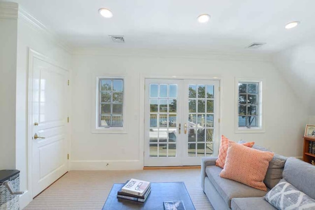 living room featuring ornamental molding and french doors